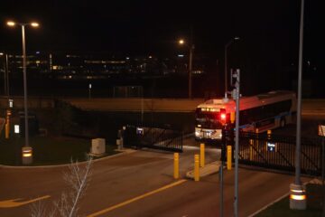 Overhead photo of an out-of-service GRT bus driving at night in Waterloo, Ontario.