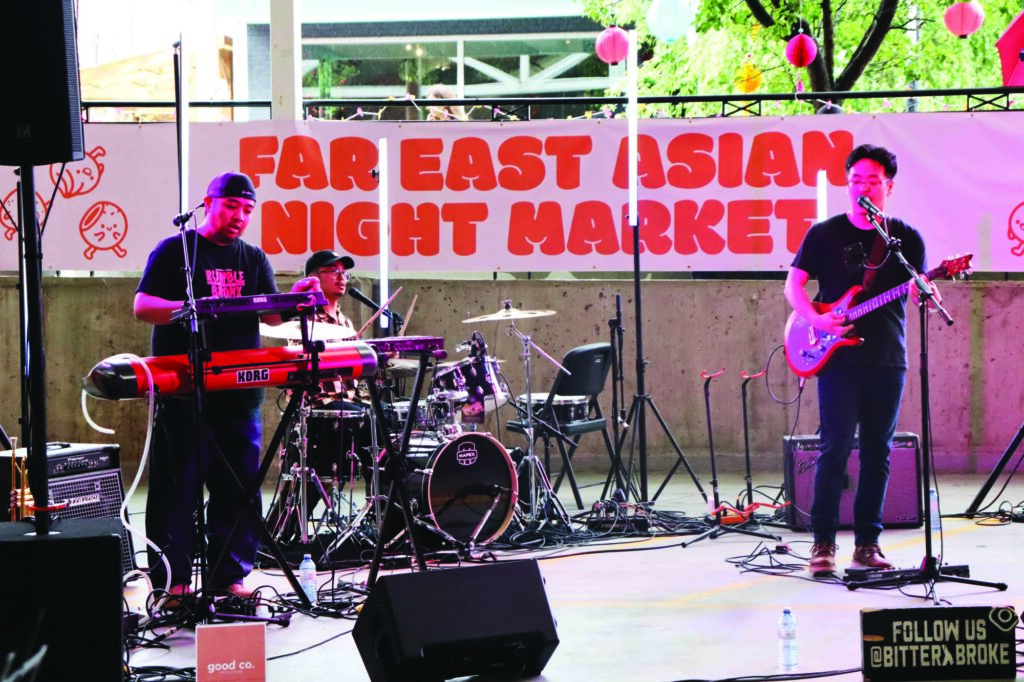 Photo of the Toronto-based band Bitter&Broke performing a set at the Kitchener Far East Asian Night Market, held on August 18th, 2024.